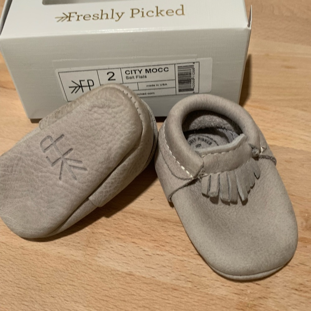 Light gray freshly picked leather moccasins